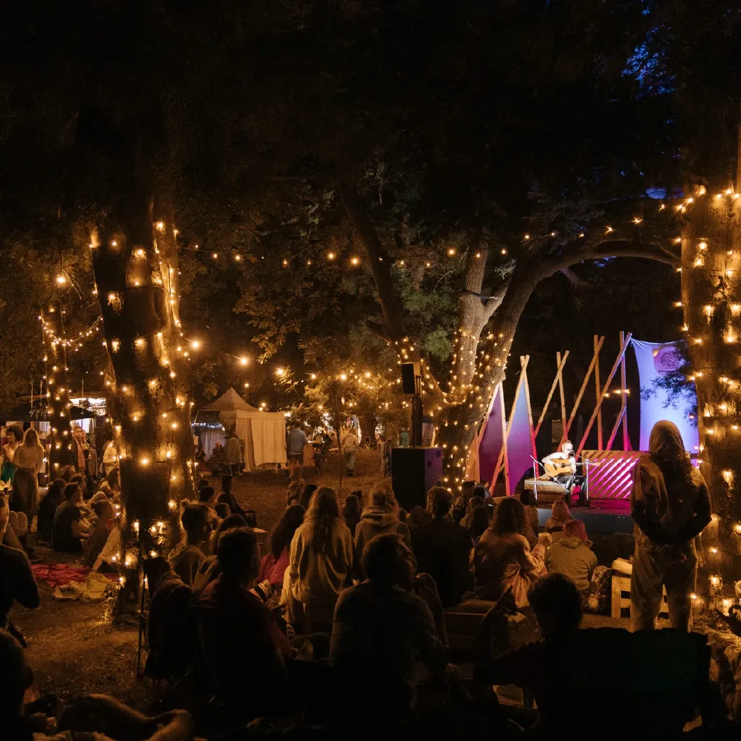 A photograph of Retreat Yourself at night