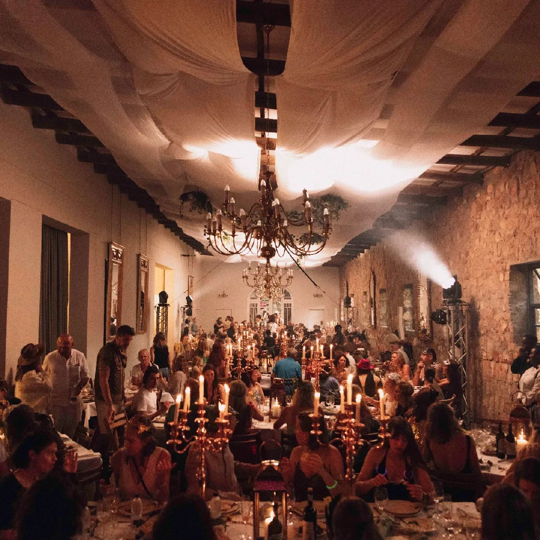 A photograph of people sitting inside a restaurant at Retreat Yourself